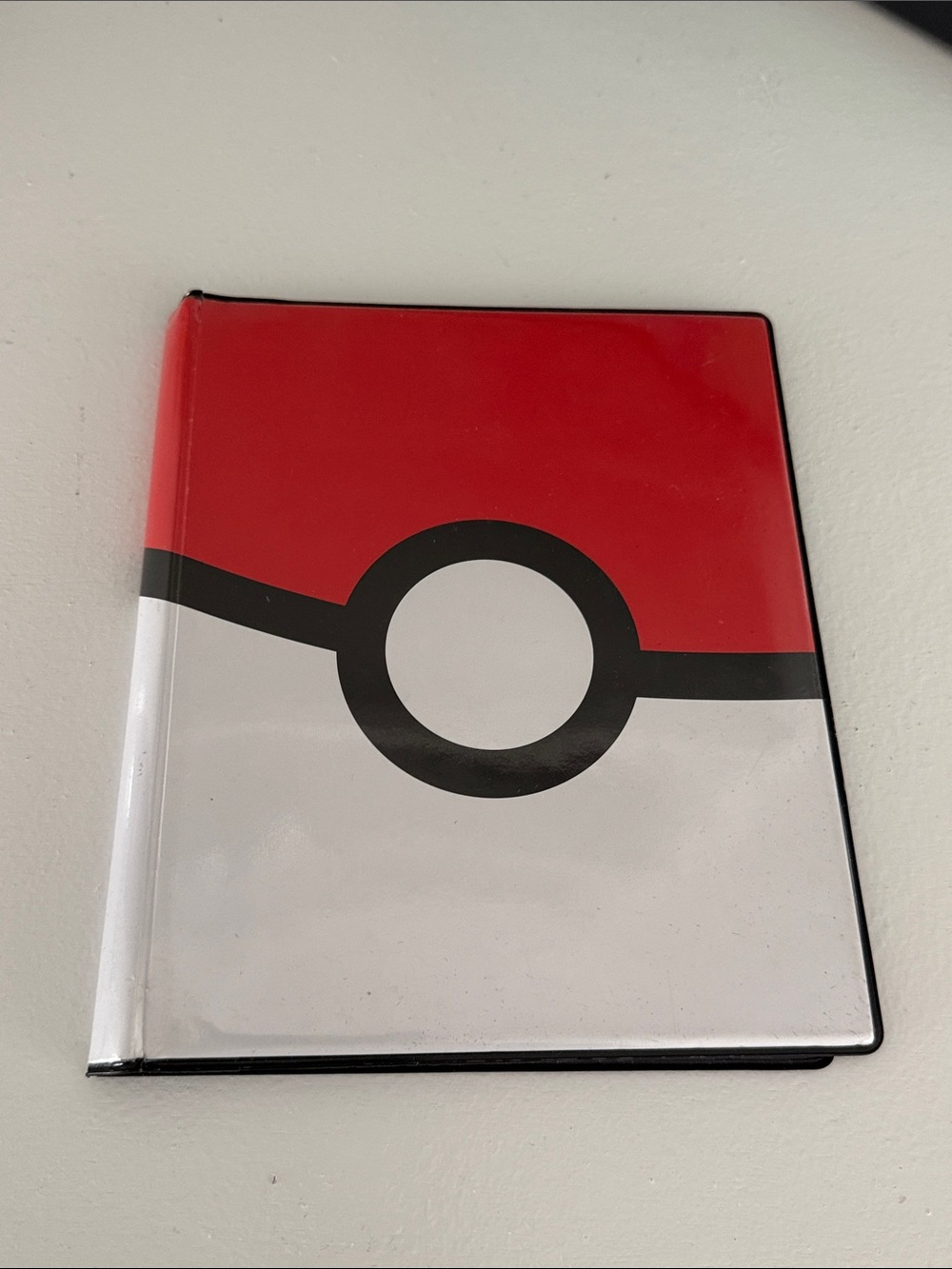 Pokemon Red, White & Black Poké Ball Game Binder. Hold a total of 80 cards.